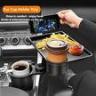 Car cup holder tray with a phone, coffee, and fries on a car dashboard.