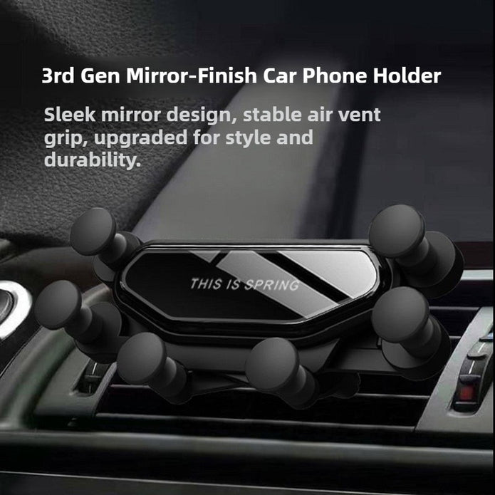 Car phone holder with 'This is Spring' branding on a car dashboard.