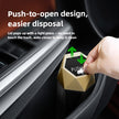 Push-to-open trash can with lid popping up in a car's cup holder.