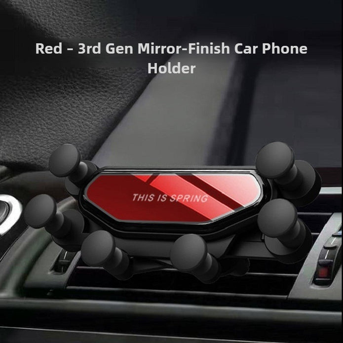 Car phone holder with red finish and 'This is Spring' text on a car dashboard.