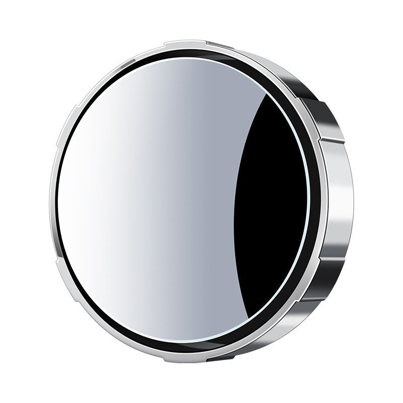 Round metallic object with reflective surface on a white background