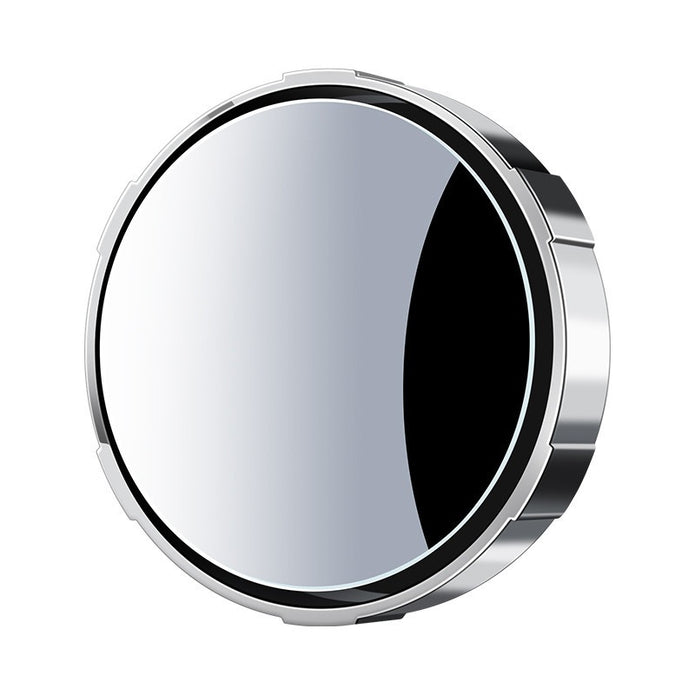 Round metallic object with reflective surface on a white background