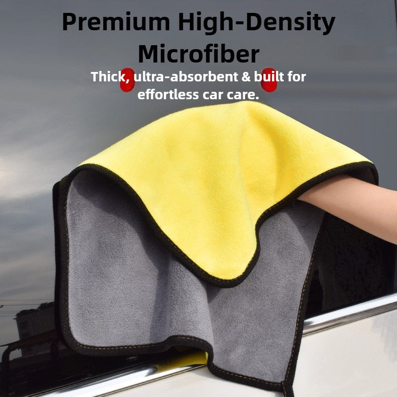 Gray and yellow microfiber towel with text about high-density microfiber on a car surface.