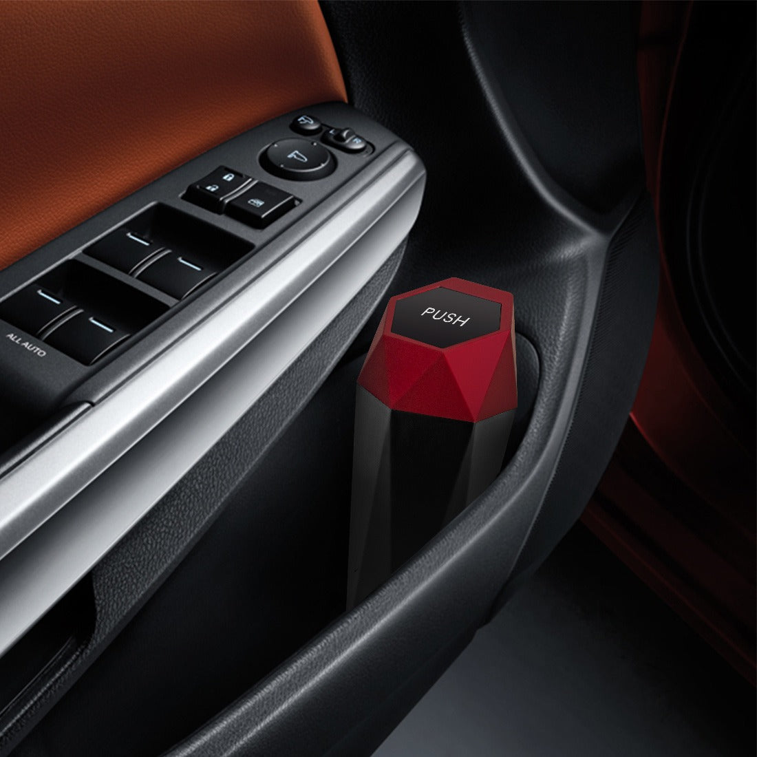 Car interior with a red hexagonal car air freshener and control panel.