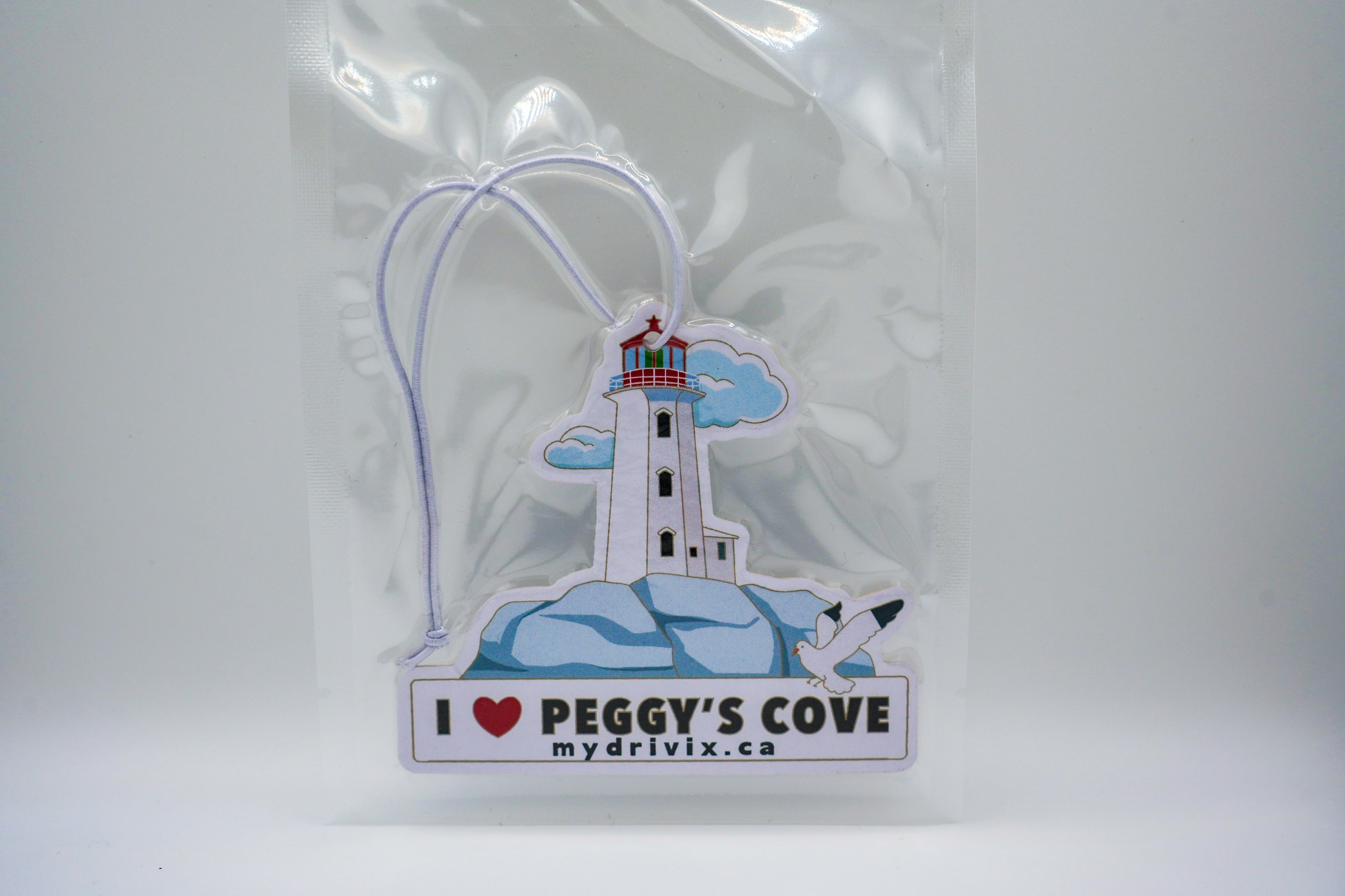 Lighthouse-themed car air freshener with 'I ❤️ Peggy's Cove' text on a white background
