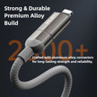Metallic cable with connectors on a dark background, emphasizing durability and strength.