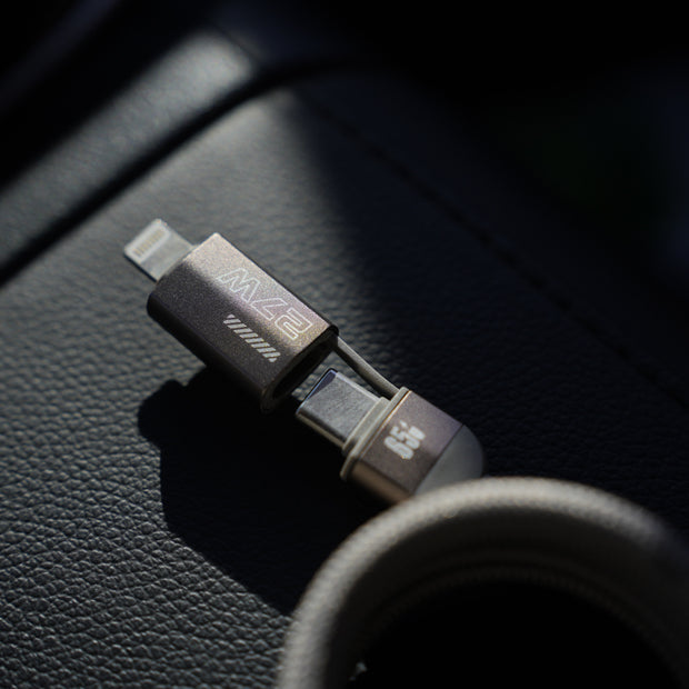 Multi-device charging cable on a car dashboard