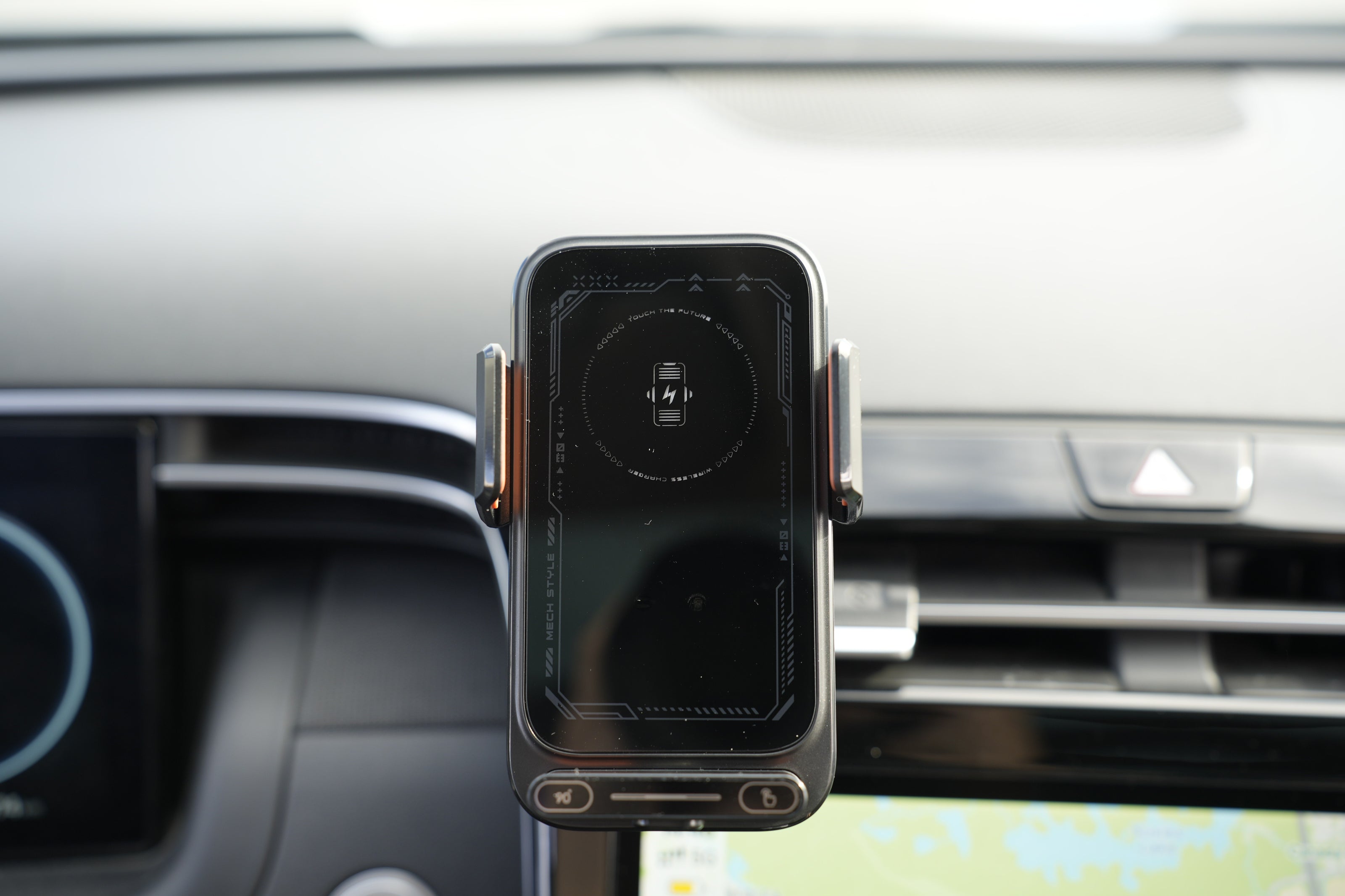 Phone holder with a smartphone on a car dashboard