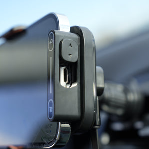 Phone mount on a car window with a blurred background