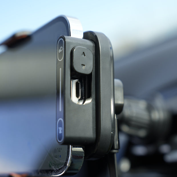 Phone mount on a car window with a blurred background