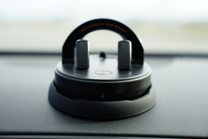 Car air freshener hanging from a clip on a car dashboard