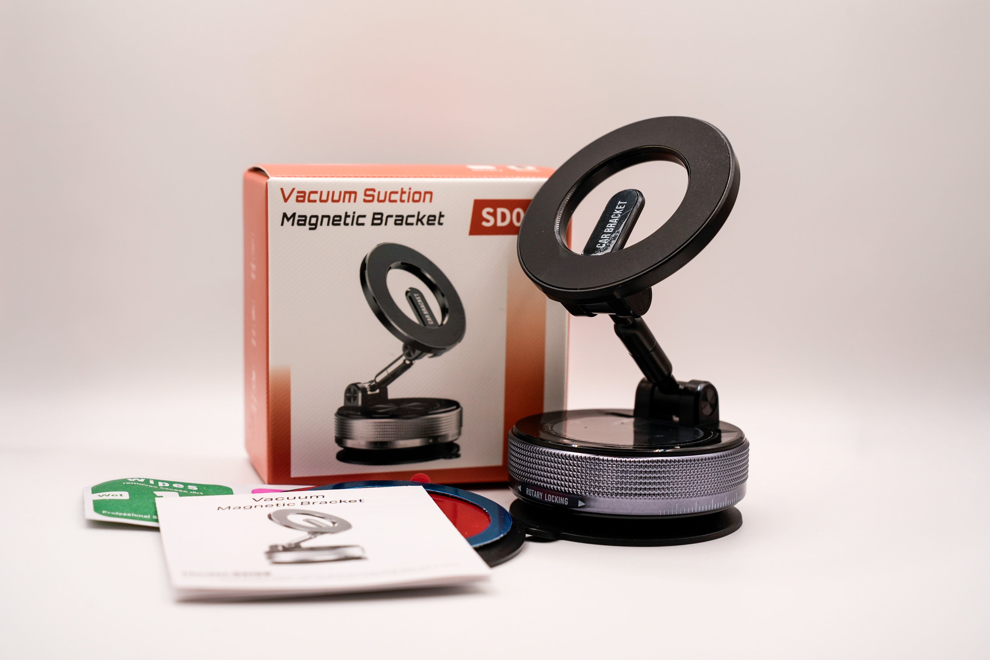 Vacuum suction magnetic bracket with packaging on a white background