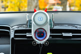 Car phone holder with devil horns and tail design on a car dashboard