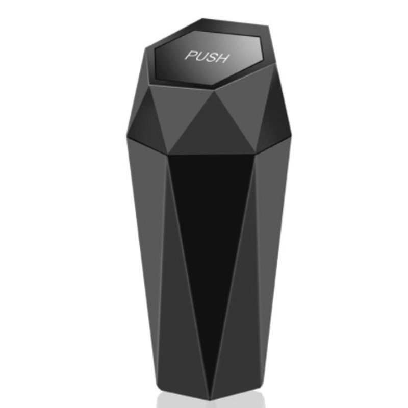 Black geometric device with 'PUSH' button on a white background