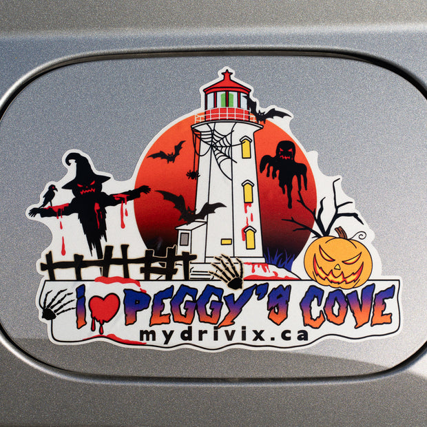 Halloween-themed sticker with a lighthouse and text on a car window