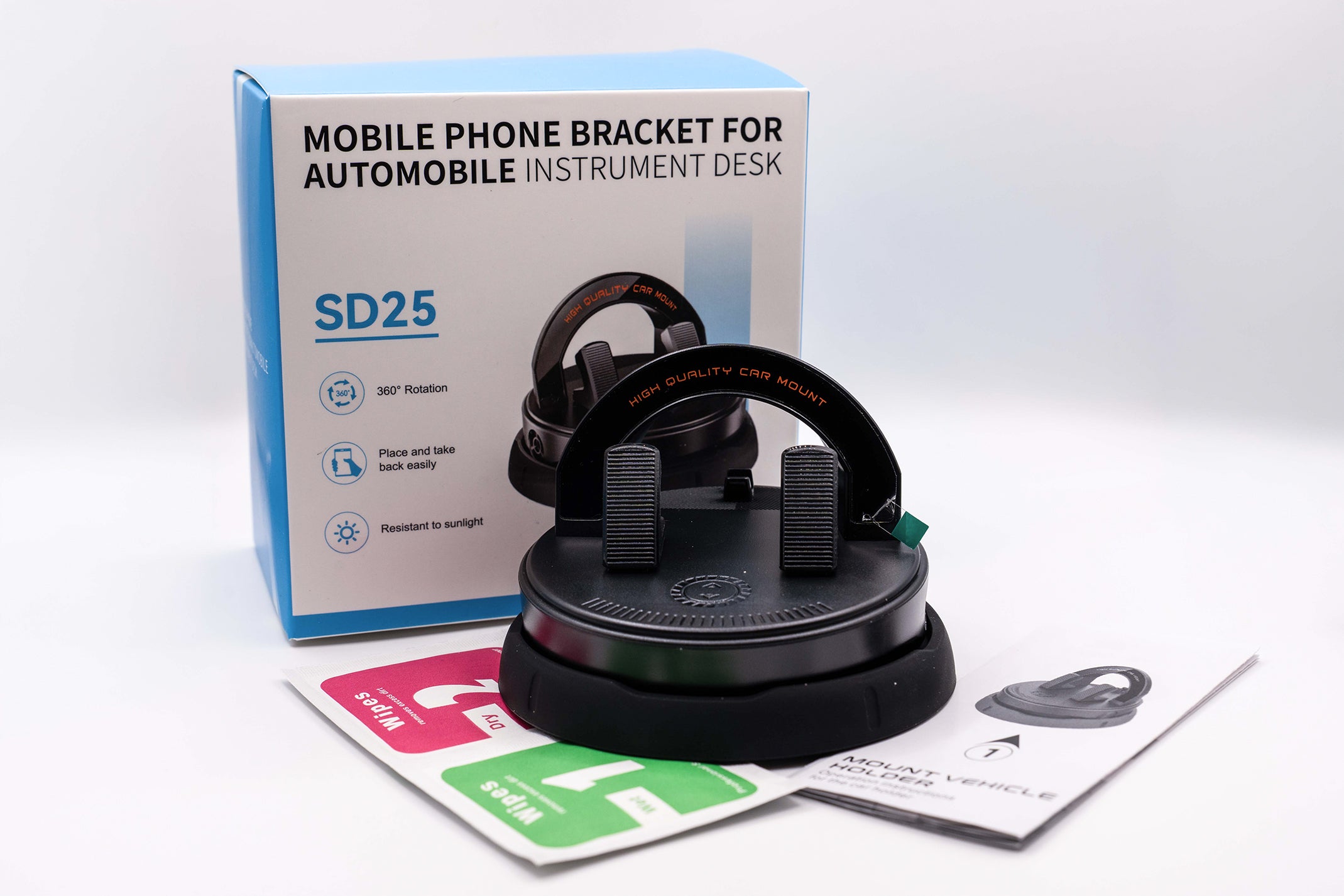 Mobile phone bracket for automobile instrument desk with packaging and accessories on a white background