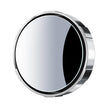 Round metallic object with reflective surface on a white background