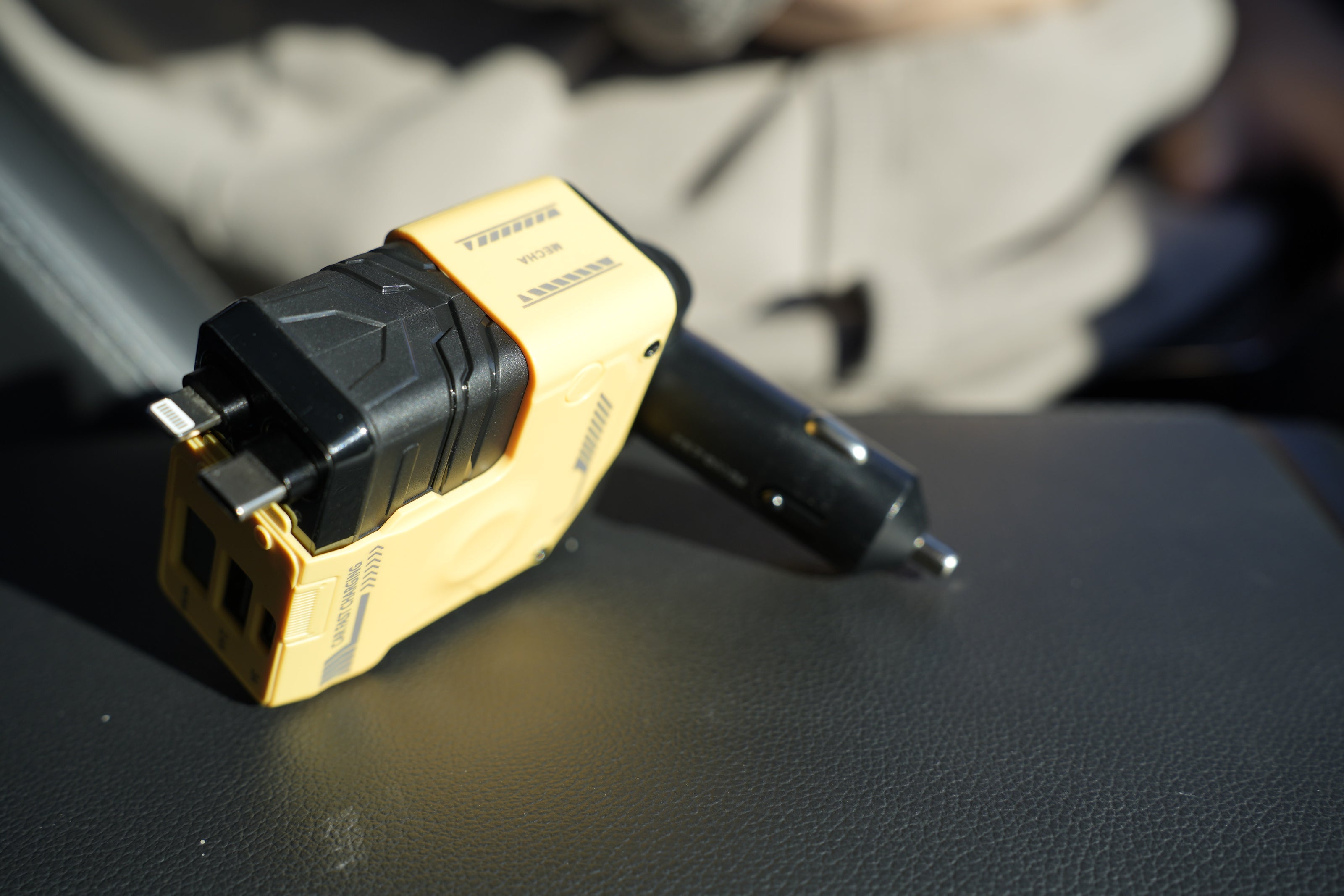 Black and gold electrical plug on a dark surface