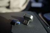 Two USB devices on a car dashboard