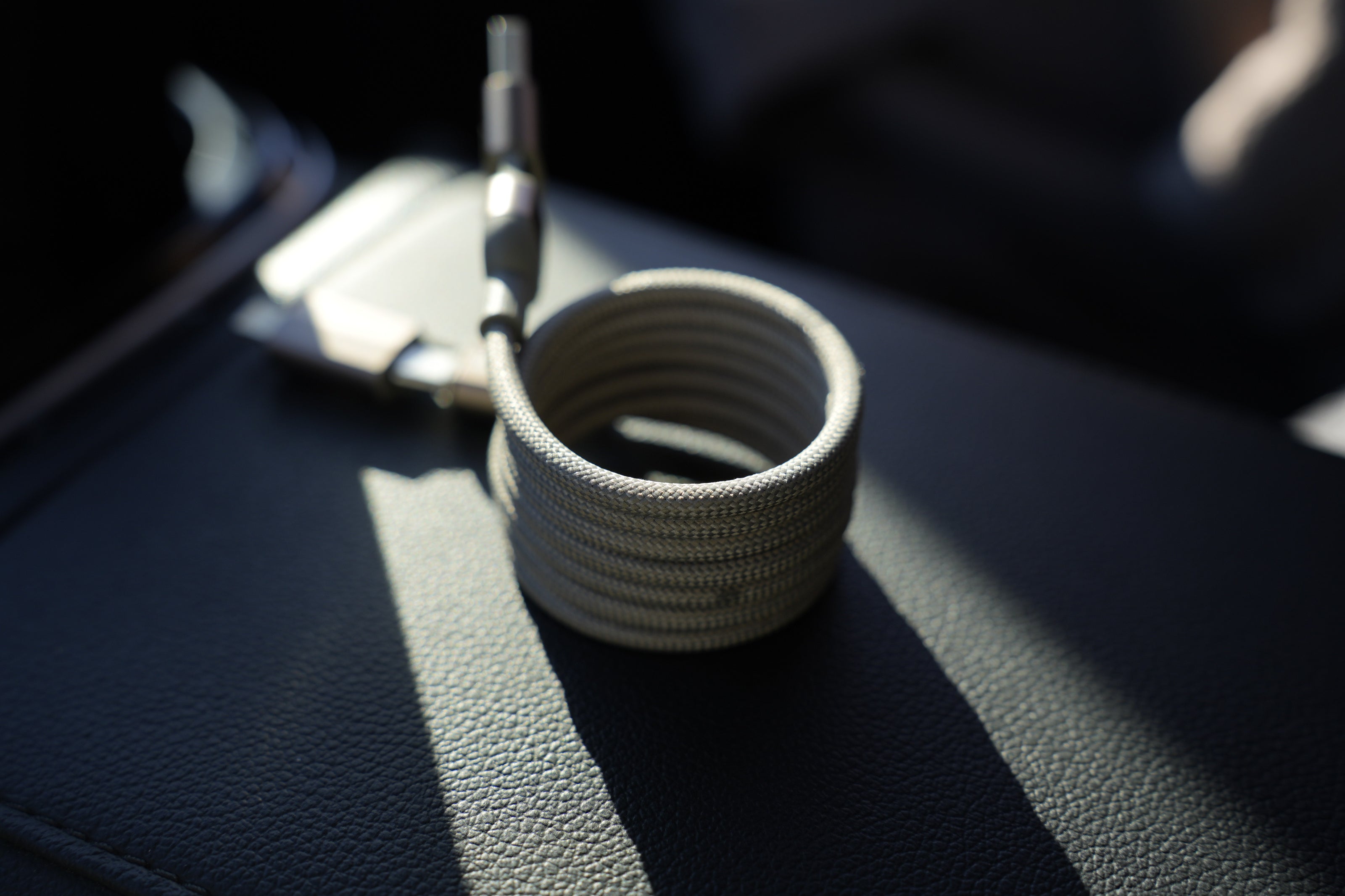 Textured keychain holder on a car dashboard