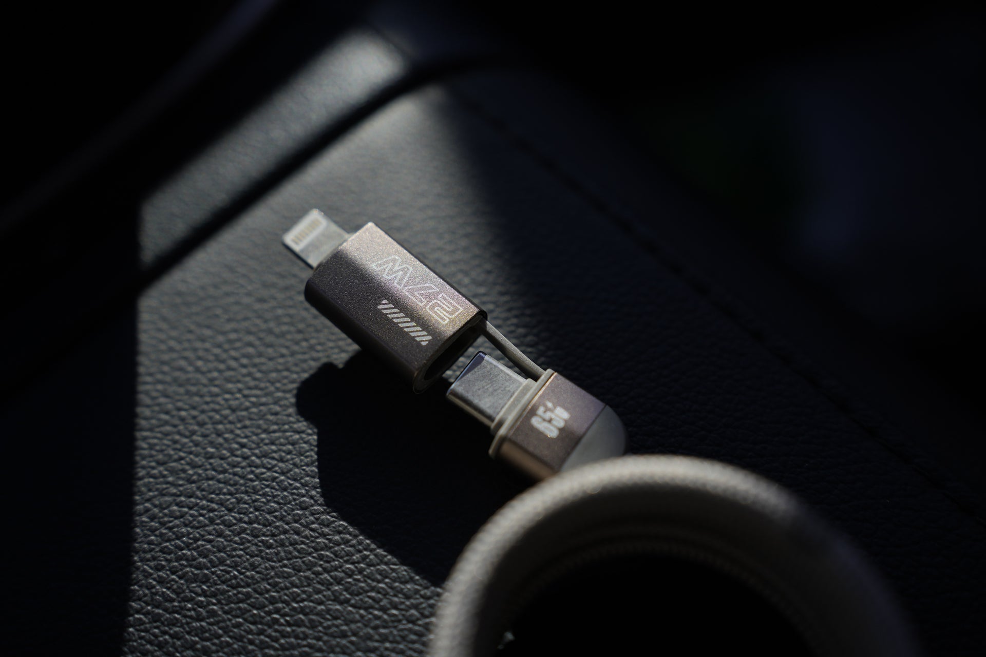 Multi-device charging cable on a car dashboard