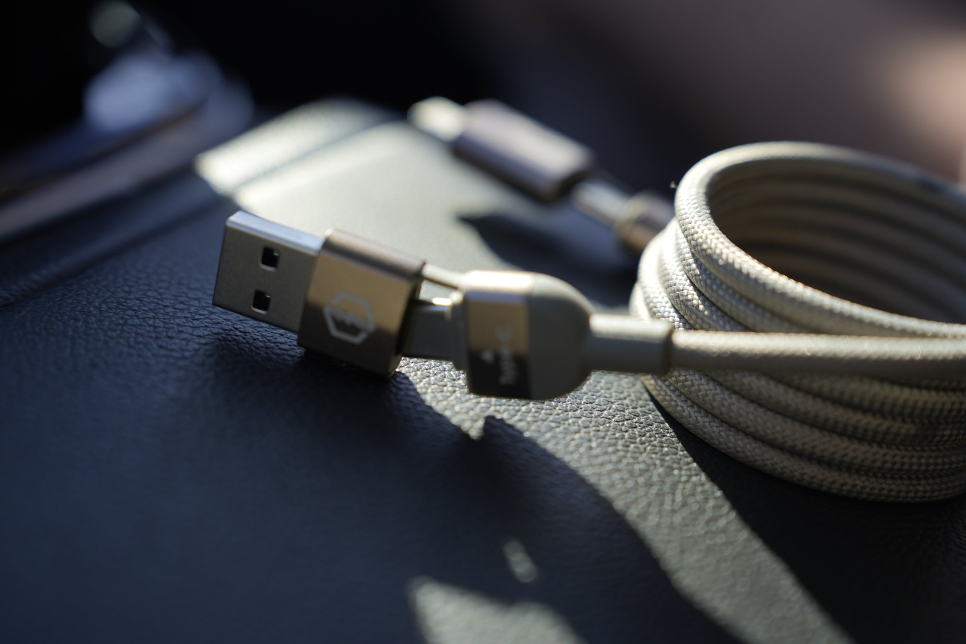 USB cable with connectors on a dark surface