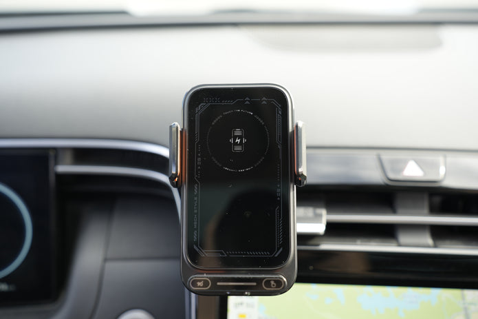 Phone holder with a smartphone on a car dashboard