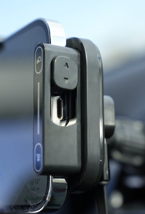 Phone mount on a car window with a blurred background