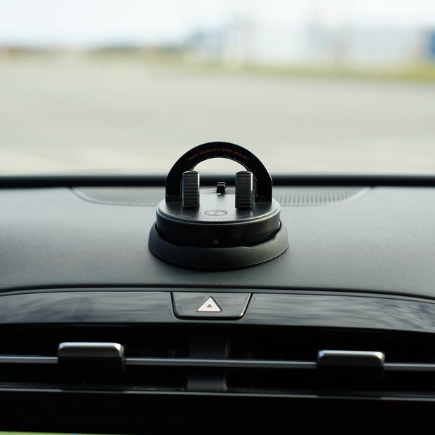 Car air freshener on a car dashboard with a blurred background