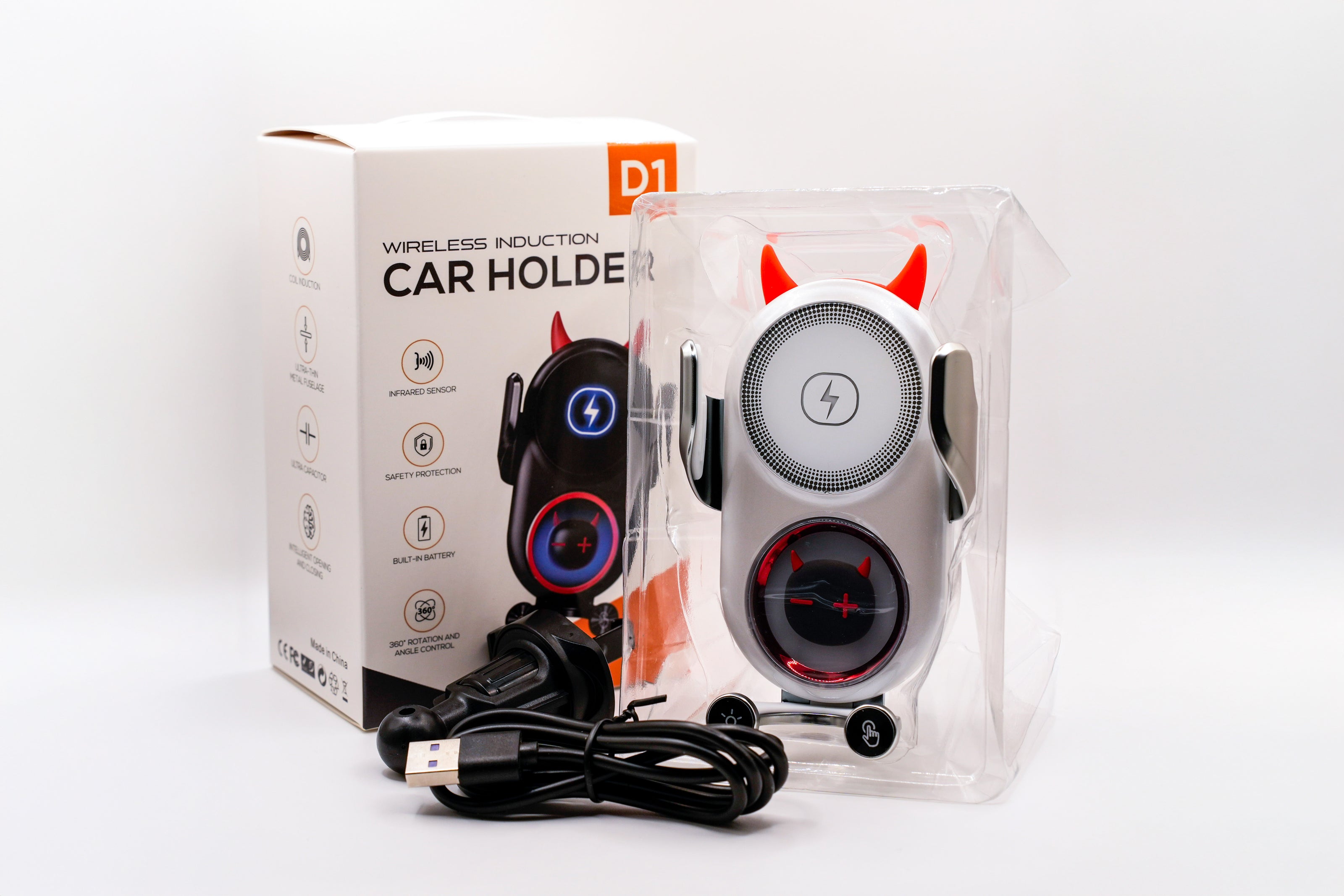 Wireless induction car holder with packaging on a white background