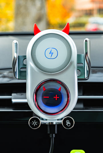 Car phone holder with devil horns and tail design on a car dashboard