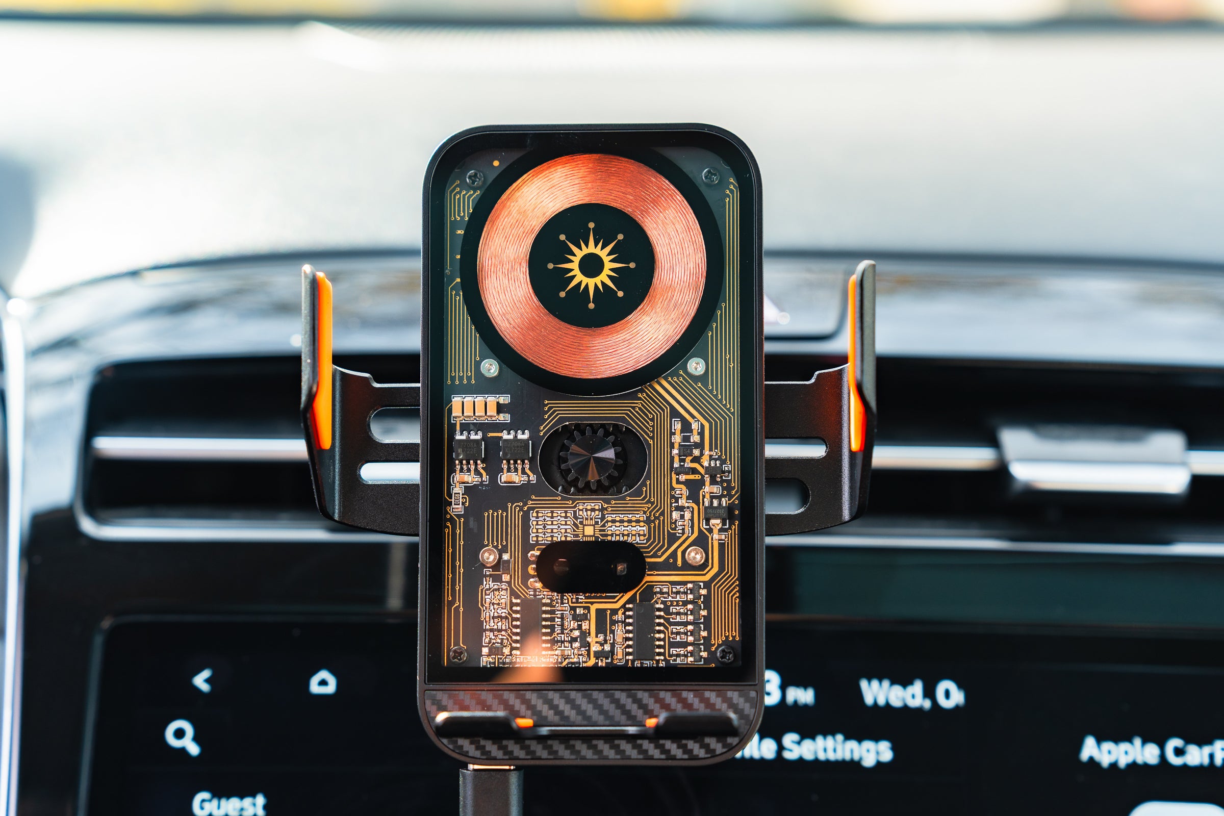 Phone with a circuit board design on a car vent mount