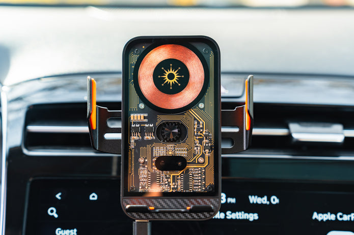 Phone with a circuit board design on a car vent mount