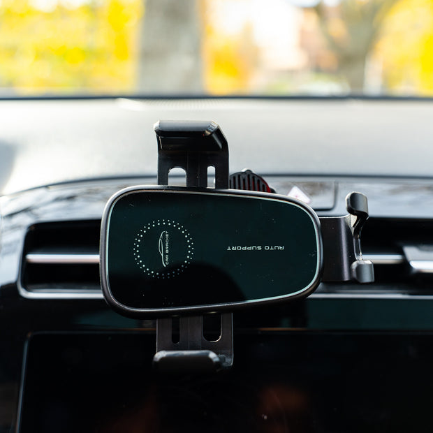 Car phone mount with brand logo on a car dashboard