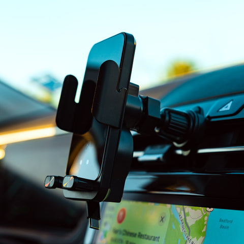 Phone mount on car dashboard with blurred interior background