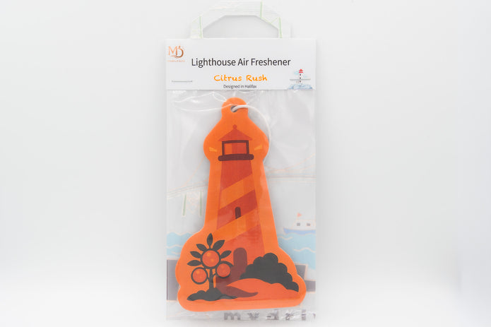 Orange lighthouse-shaped air freshener with packaging on a white background