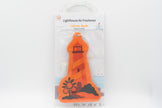 Orange lighthouse-shaped air freshener with packaging on a white background