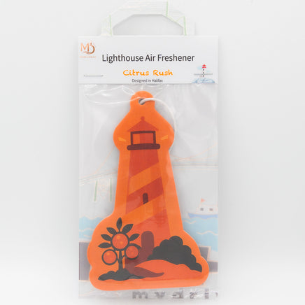 Orange lighthouse-shaped air freshener with packaging on a white background