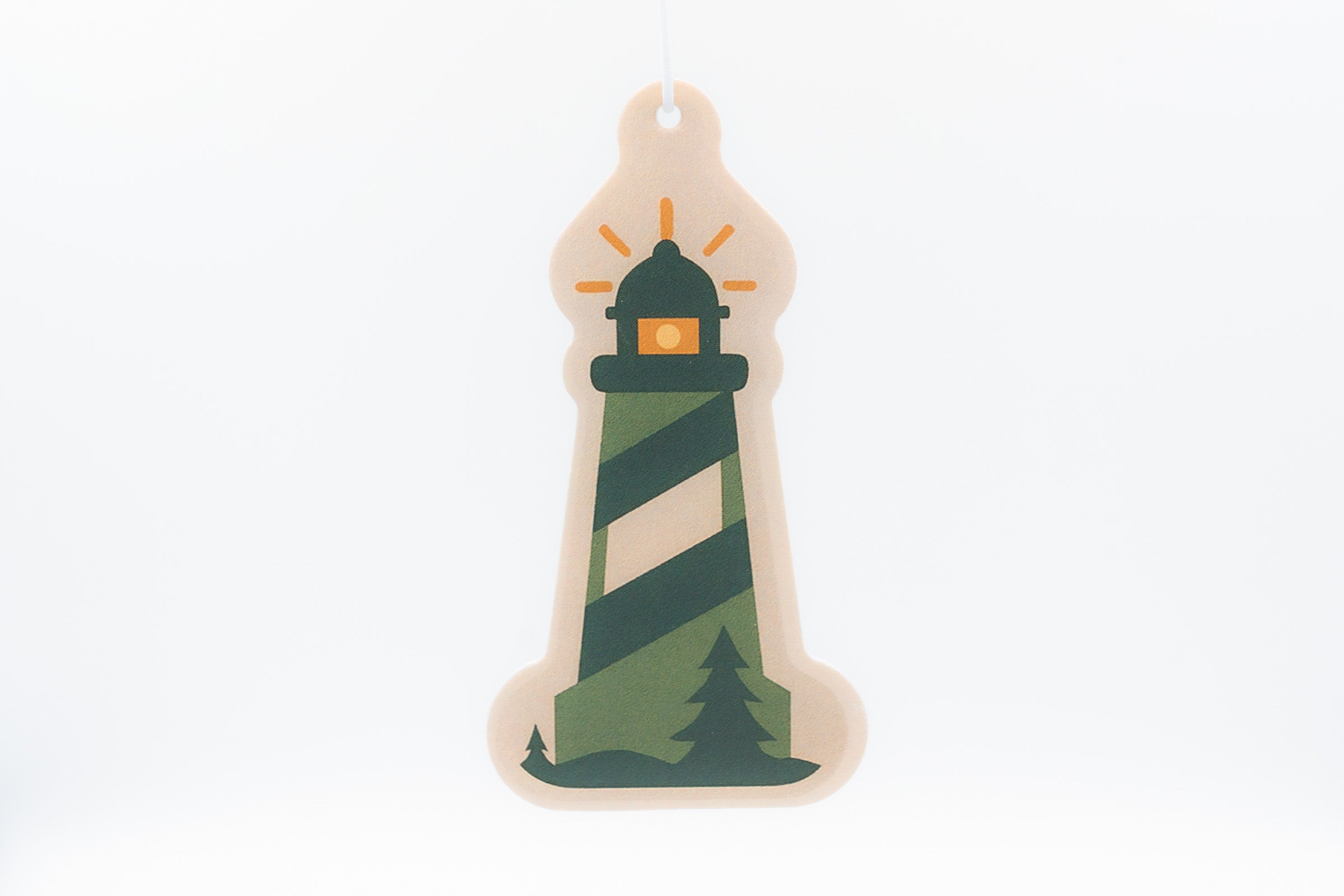 Decorative lighthouse ornament with green and beige stripes on a white background