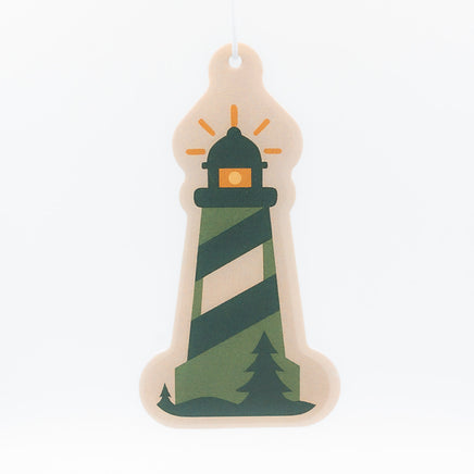 Decorative lighthouse ornament with green and beige stripes on a white background